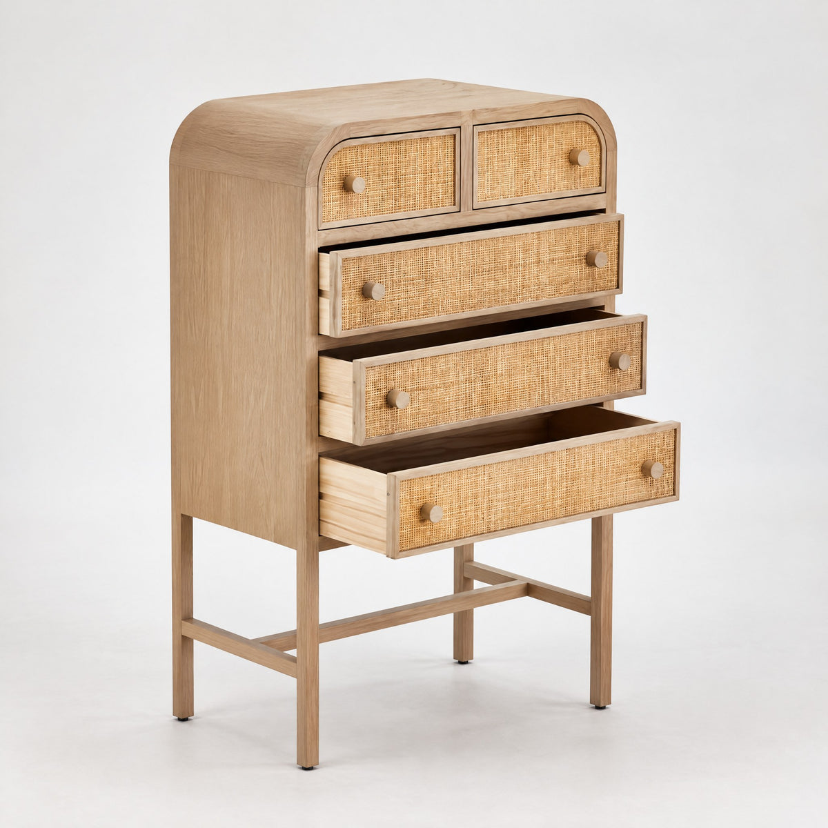 Chiffonnier cannage sur pieds, tiroirs ouverts