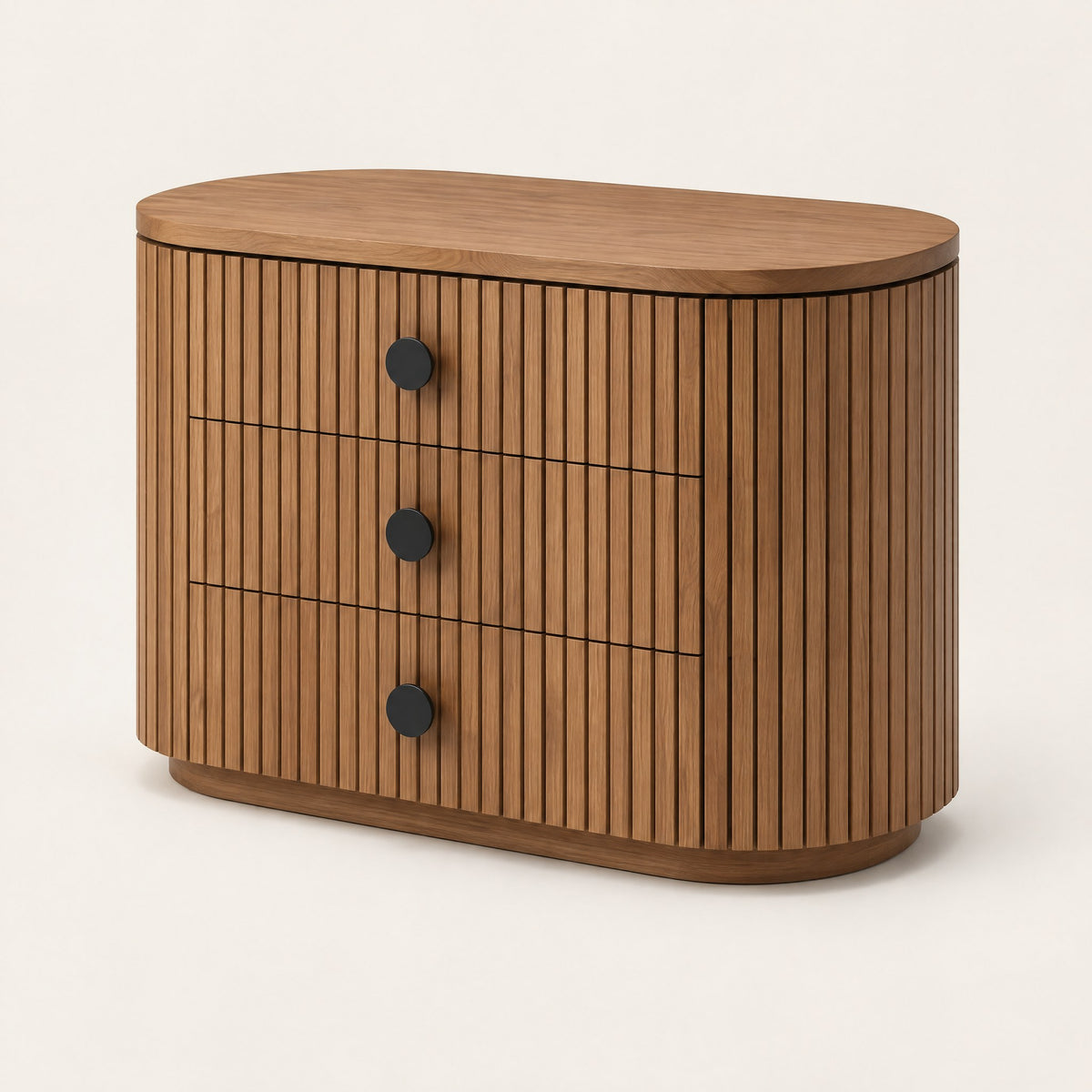 Petite commode ovale cannelée 3 tiroirs, vue de trois quarts